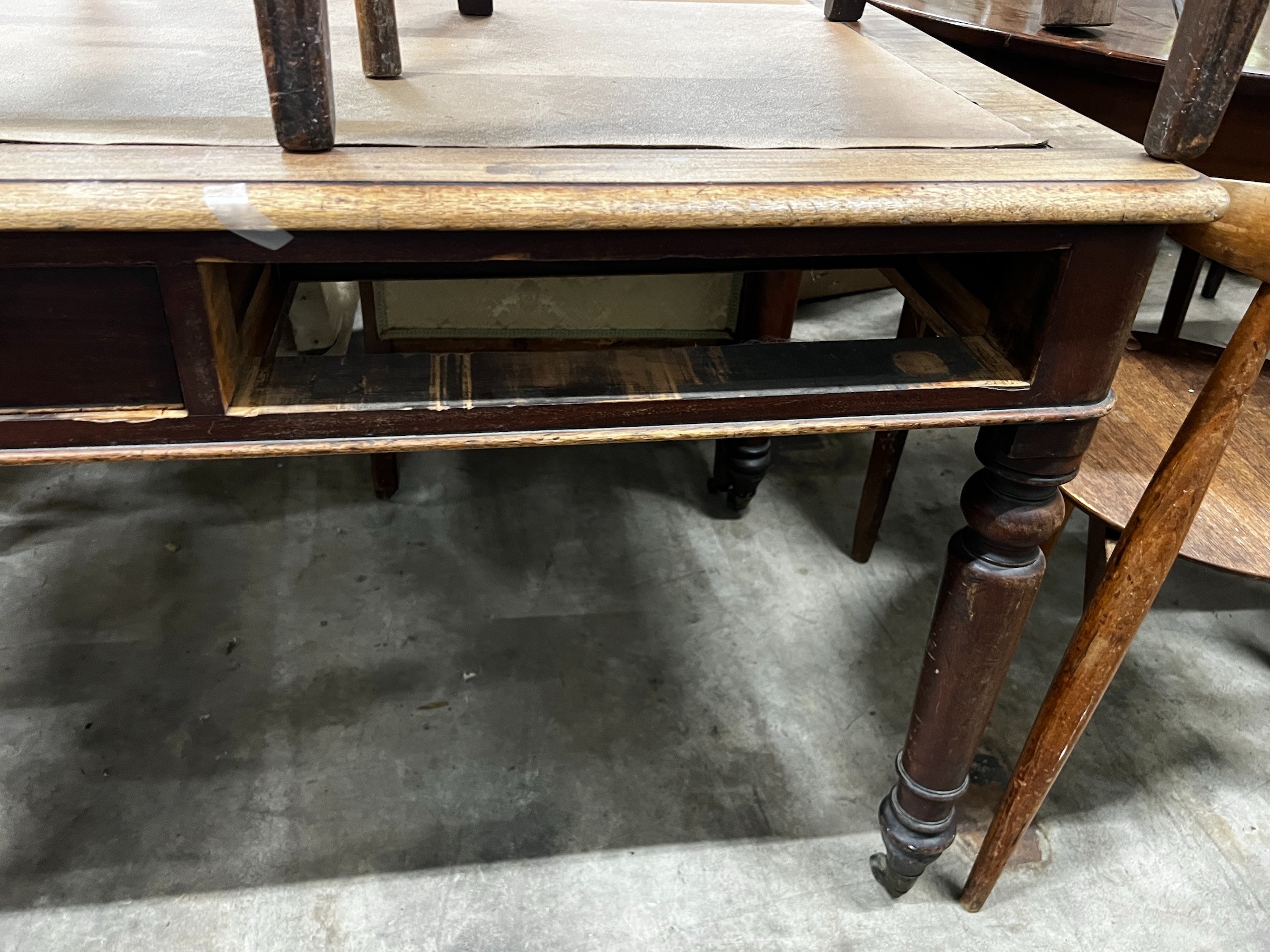 A Victorian mahogany two drawer writing table, width 120cm depth 74cm height 74cm